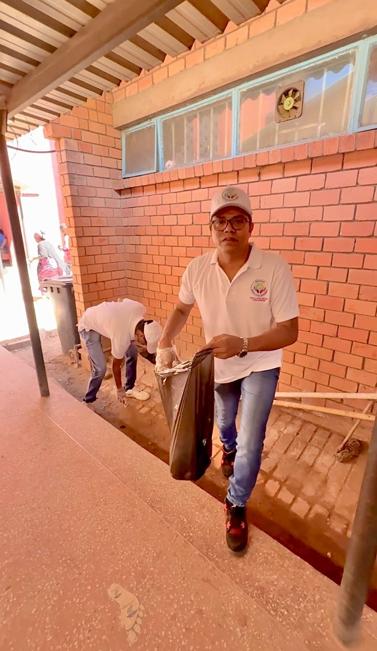 Community members participating in clean-up and tree planting